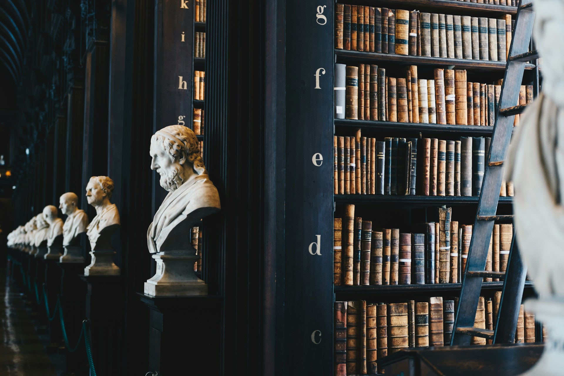 Antique bookshelves with old books in a library